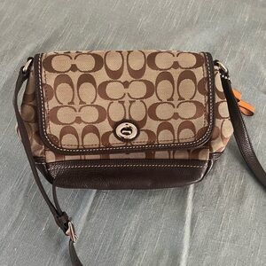 Brown and tan Cross Body Coach Purse. Great for this upcoming fall season.